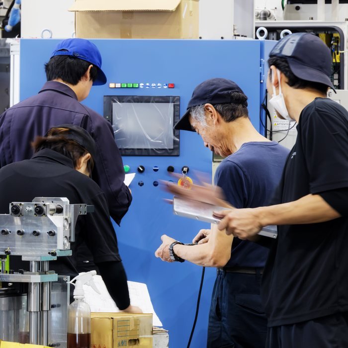 Engineers commissioning purpose-built production equipment
