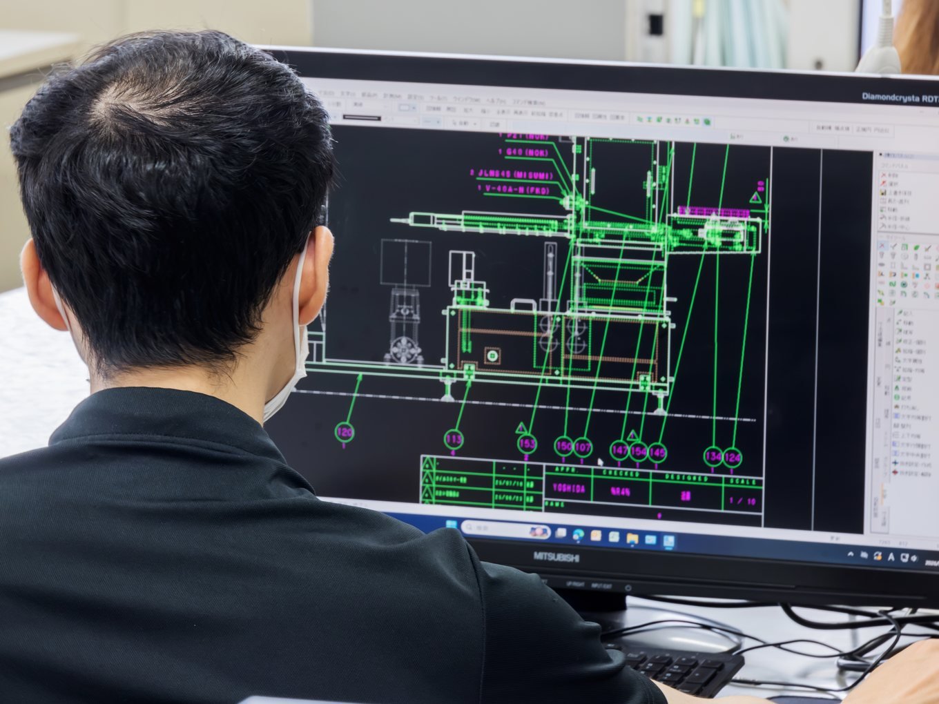 Engineer designing a custom machine in CAD
